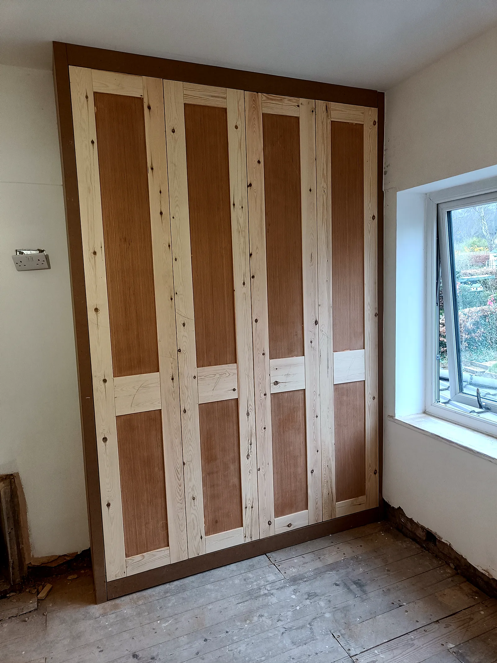 Fitted wardrobe built in place, shown before painting