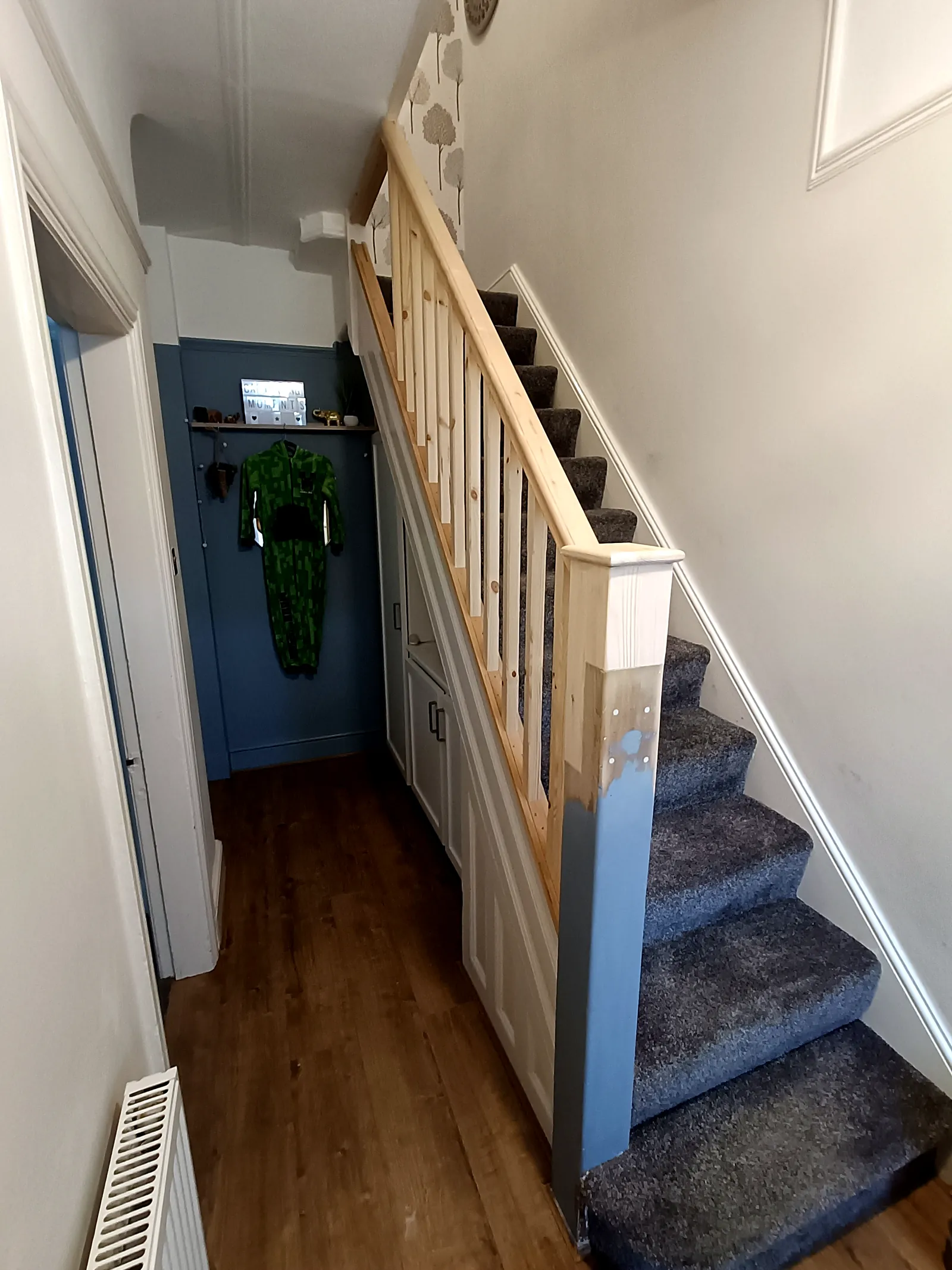 Hallway staircase with new pine balustrade, handrail and newel post