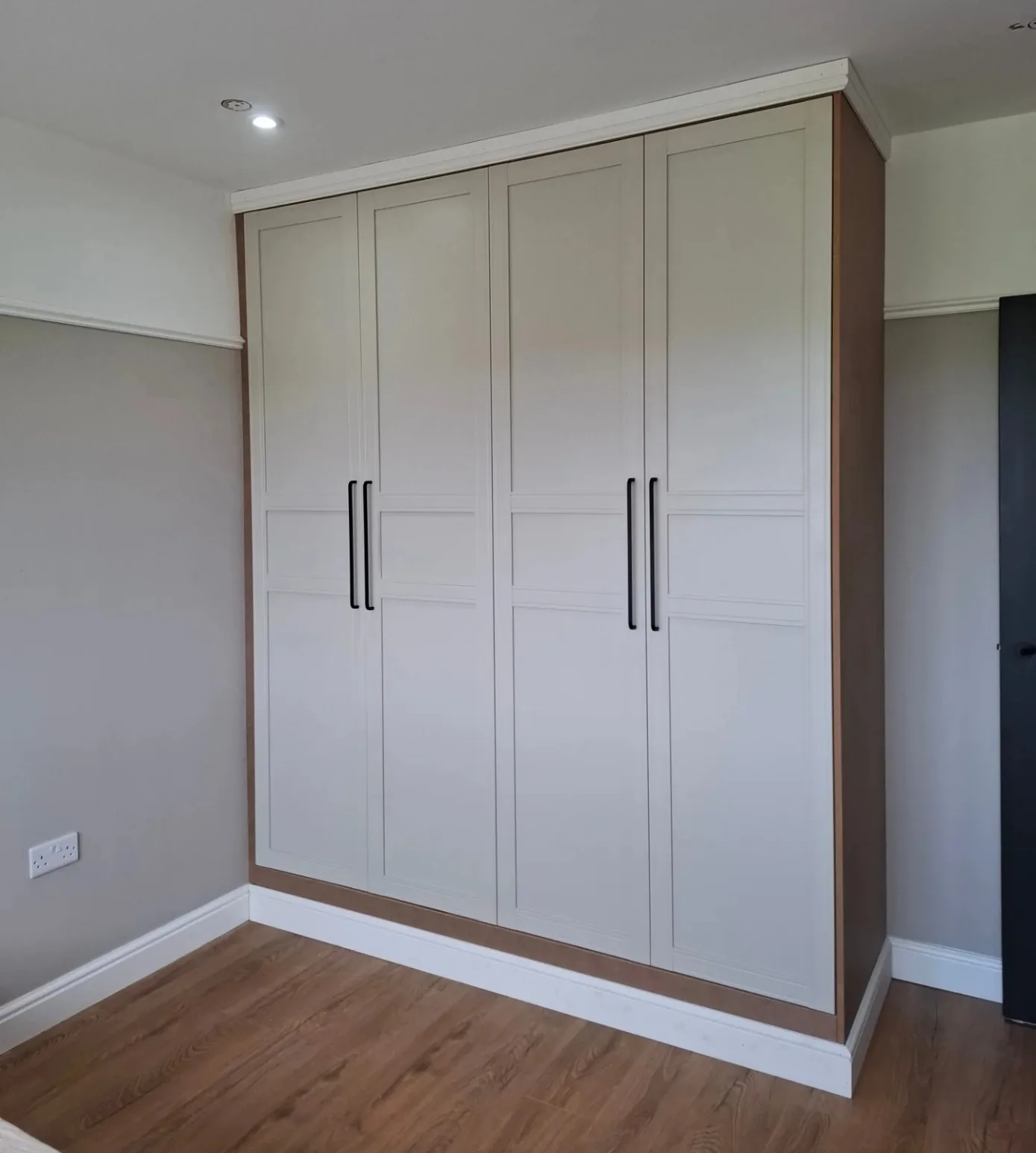 Pax wardrobes with cornice and skirting, made to look built in