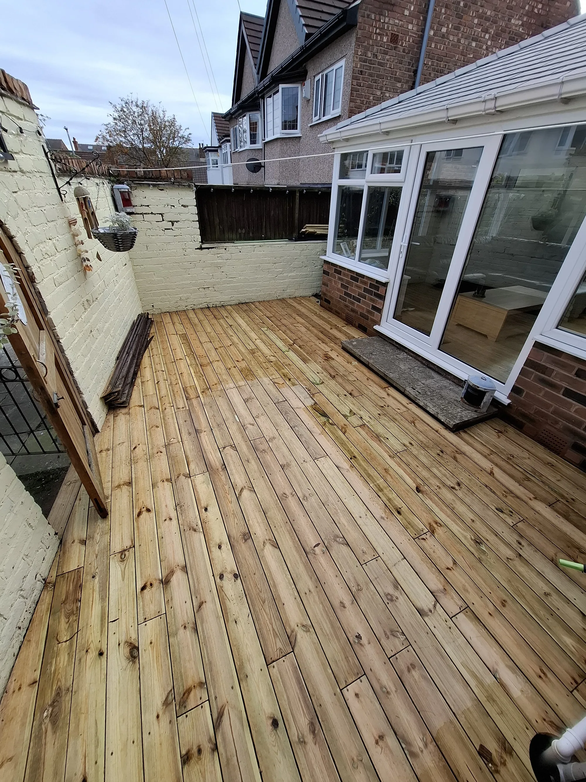 New timber decking across a rear yard