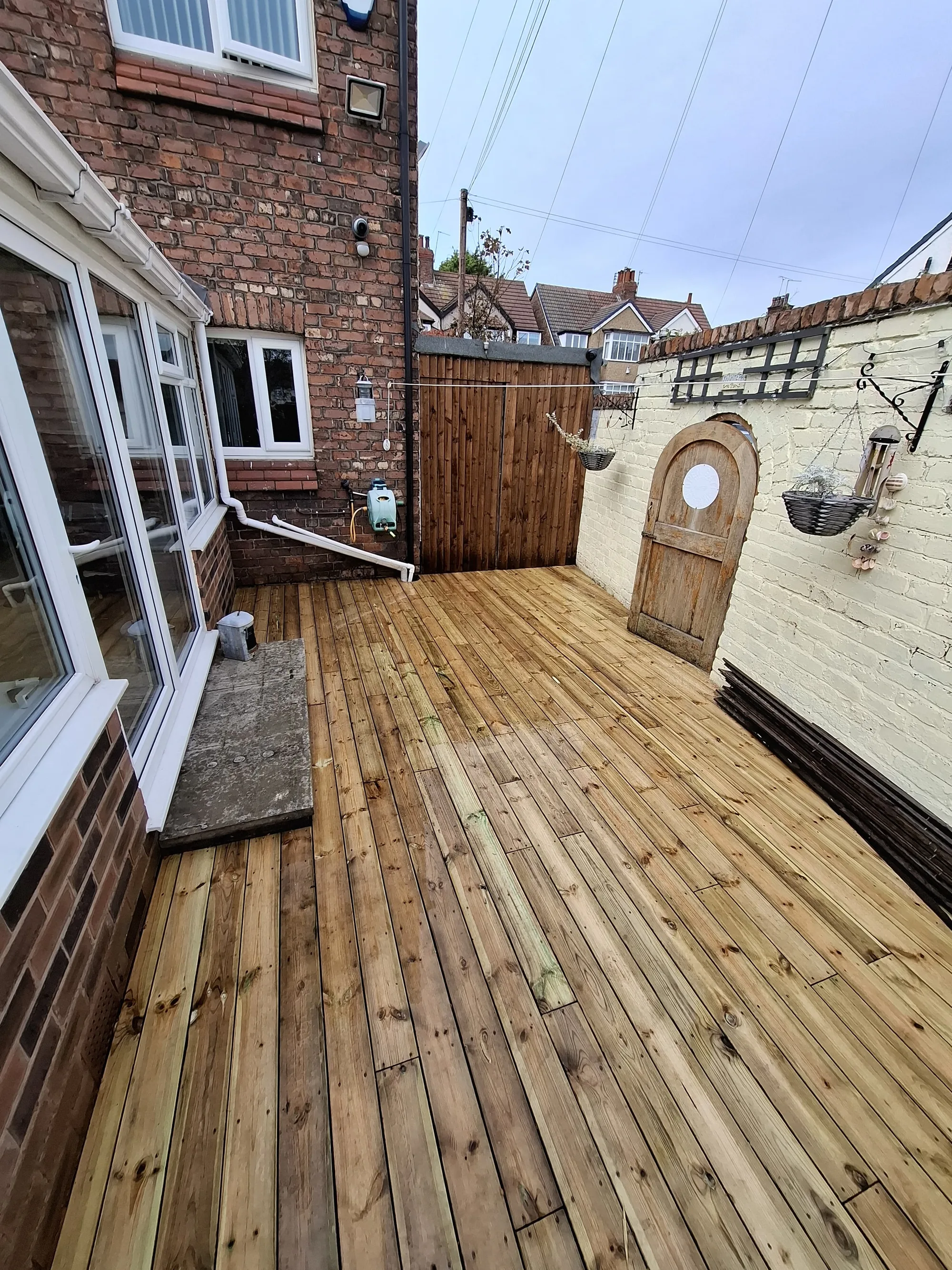 Decking running along the side of the house