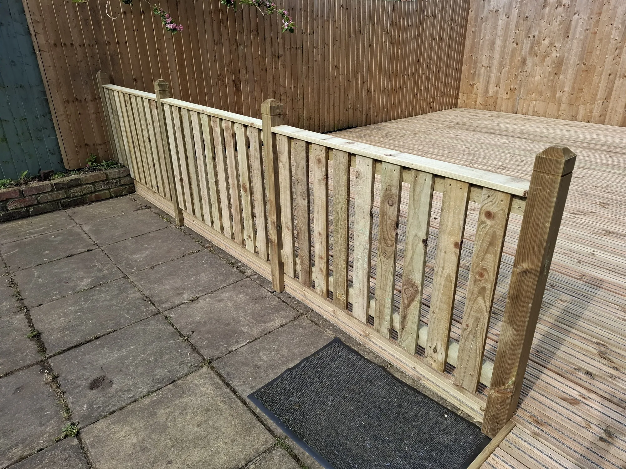 Close-up of the picket fence meeting the decking