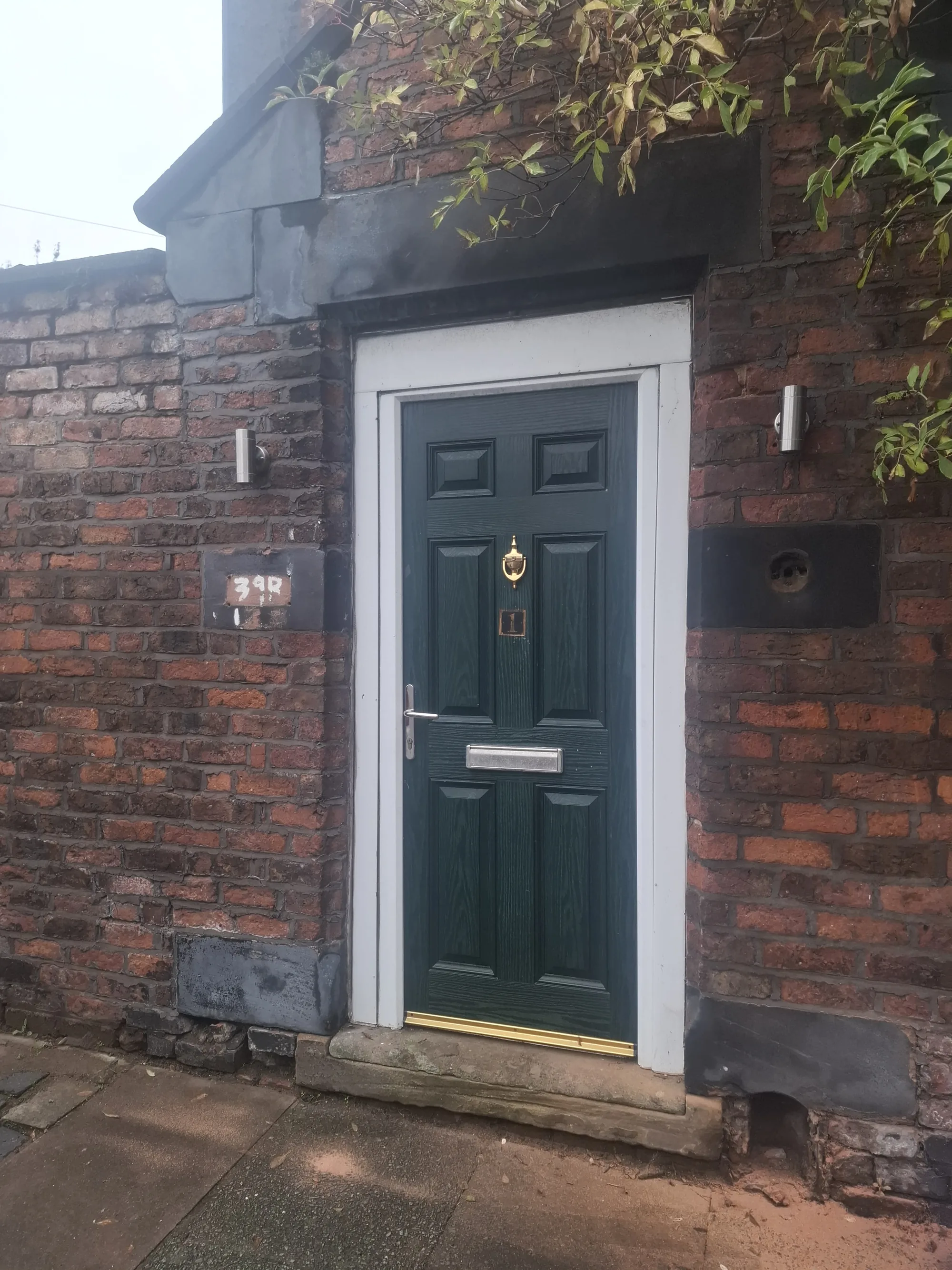 Dark green six-panel timber front door