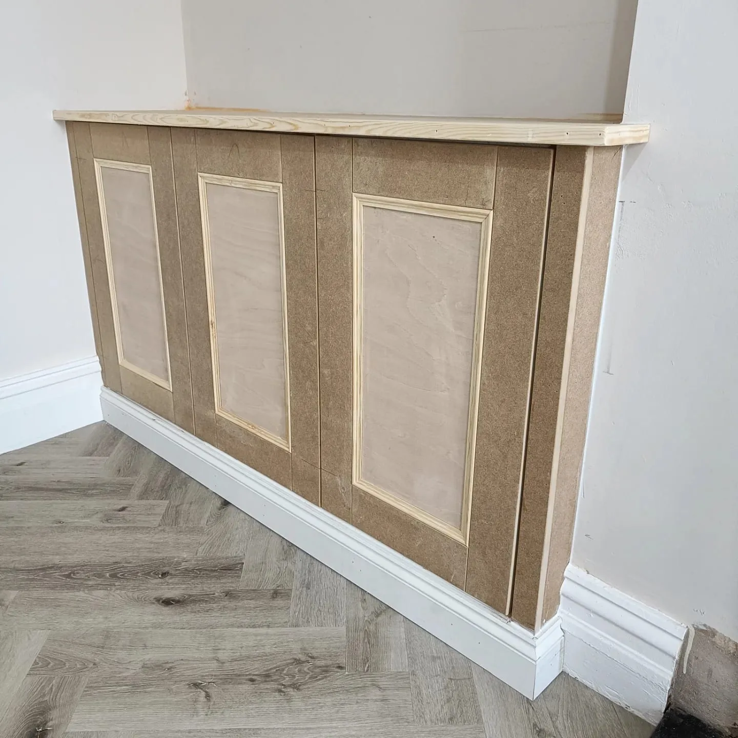 Panelled alcove cupboard before painting