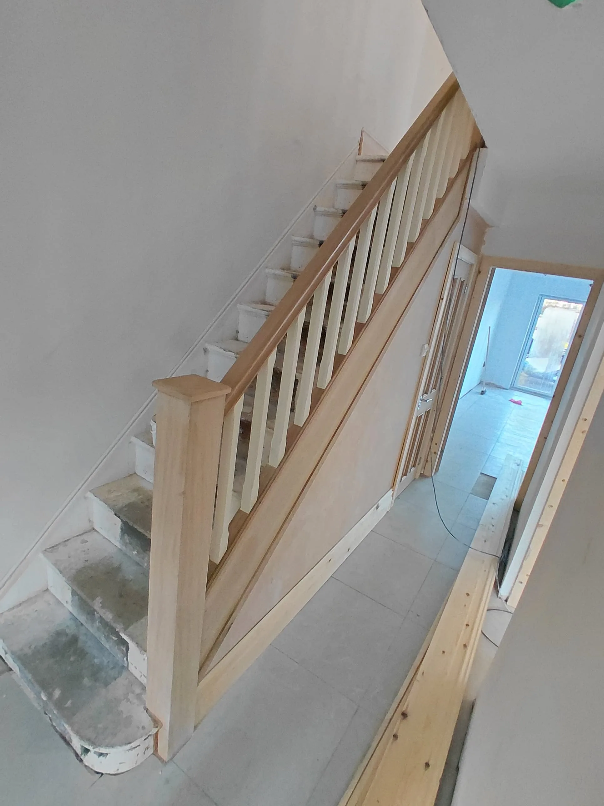 New spindles, handrail and newel post on a straight staircase